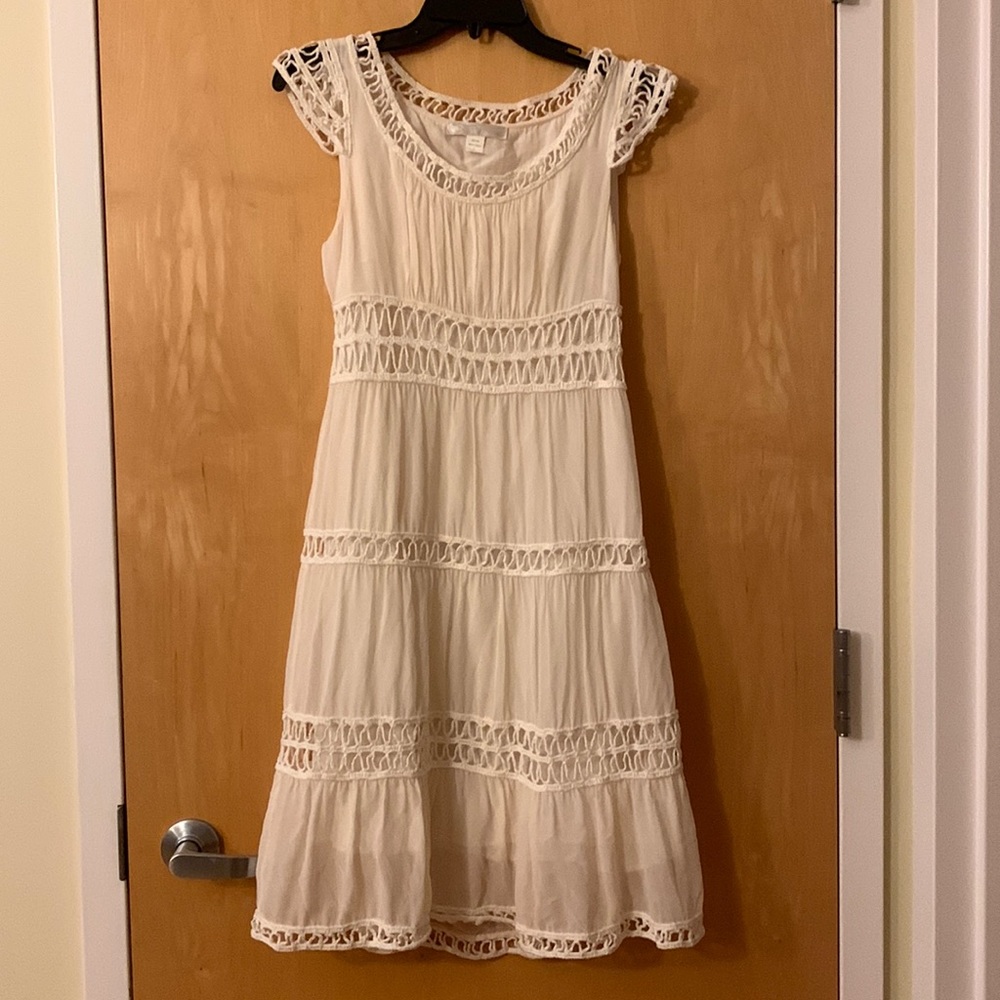 100% silk dress in a cream white color with crochet detailing